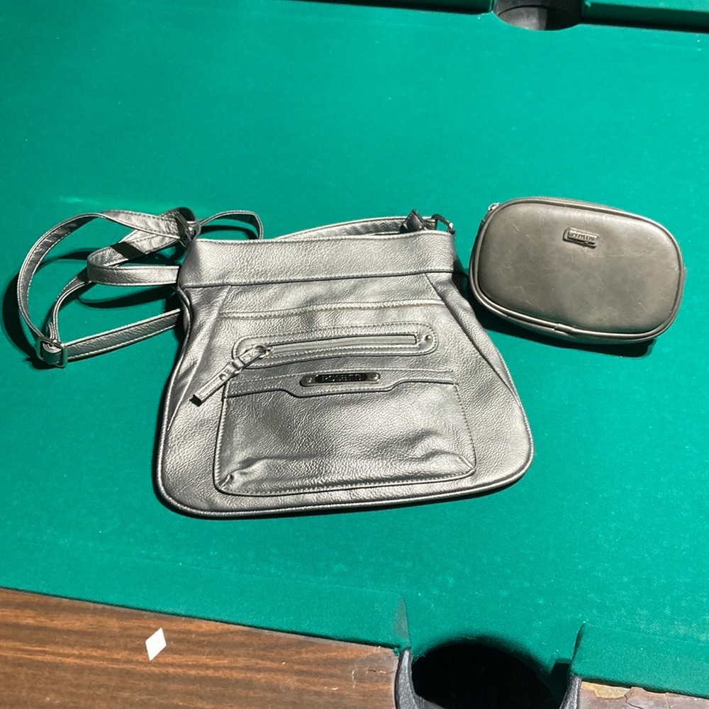 Brand new. Never used. Rosetti brand. Cross body purse. & make up bag. Will bund
